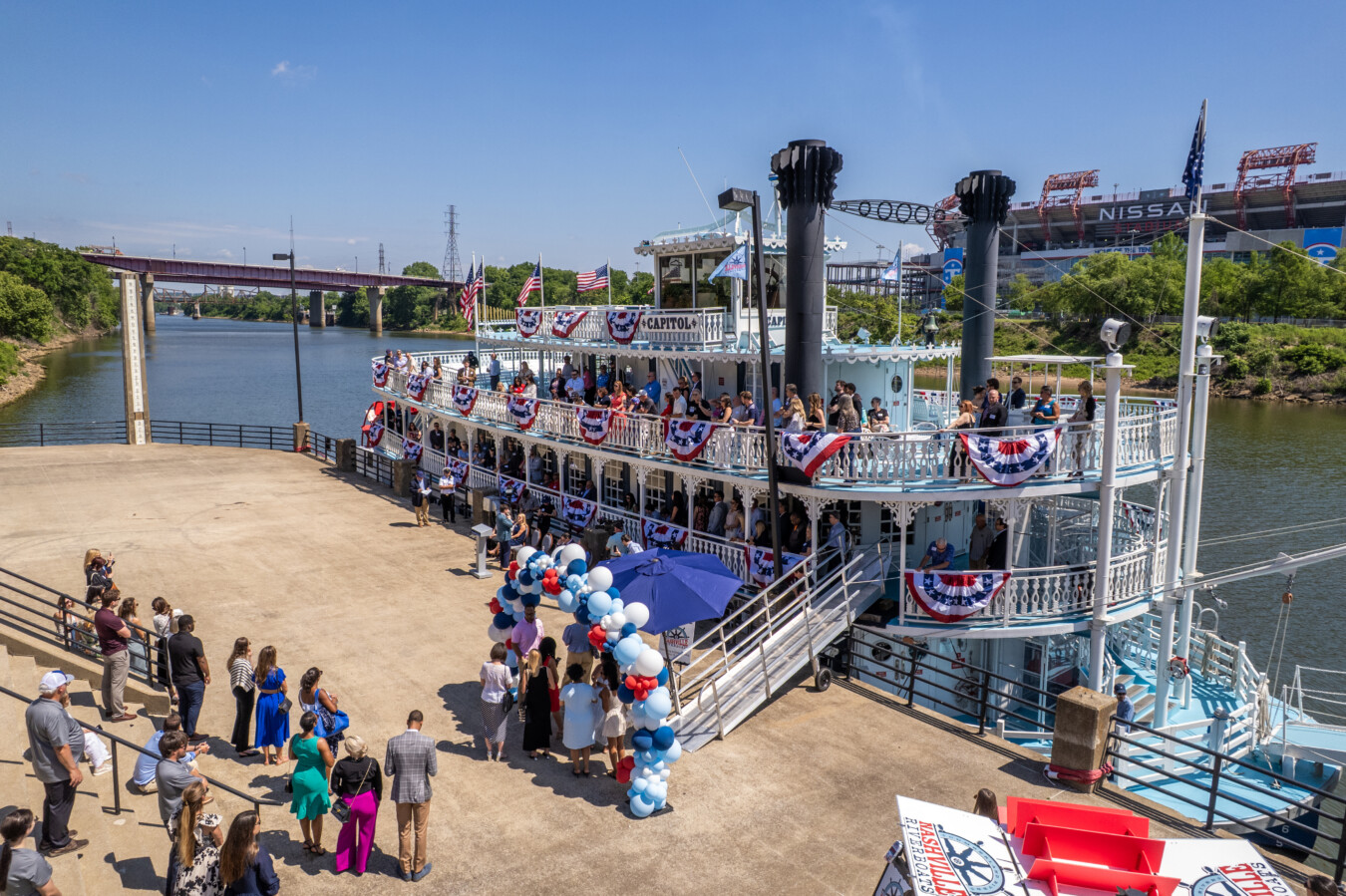 A crowd celebrating the christening of the Capitol